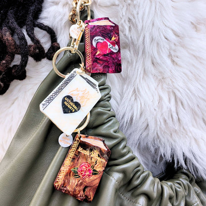 Keychain with decorative elements on a green surface