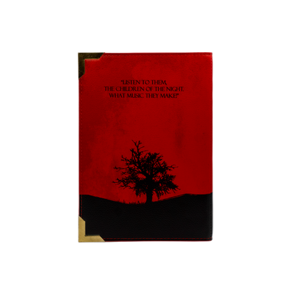 Book with red cover and black tree silhouette on a white background