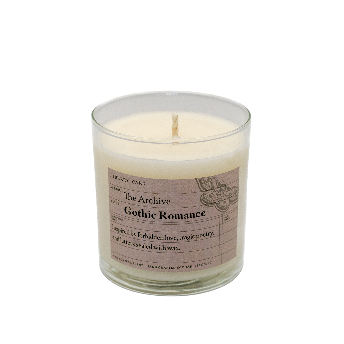 Candle in a glass jar with a label on a white background