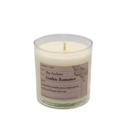 Candle in a glass jar with a label on a white background