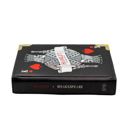 Book-shaped handbag with 'Hamlet' by Shakespeare design on a white background