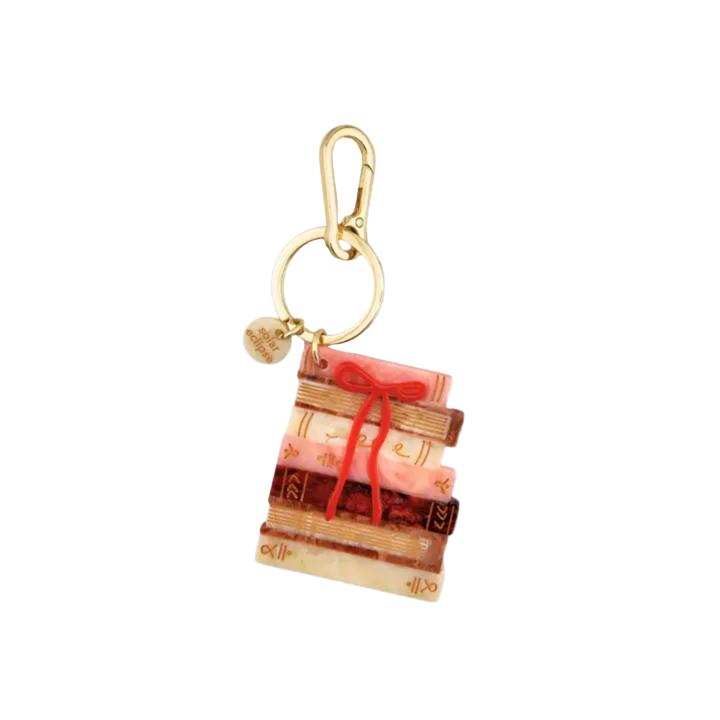 Keychain with a design of books and a red ribbon on a white background