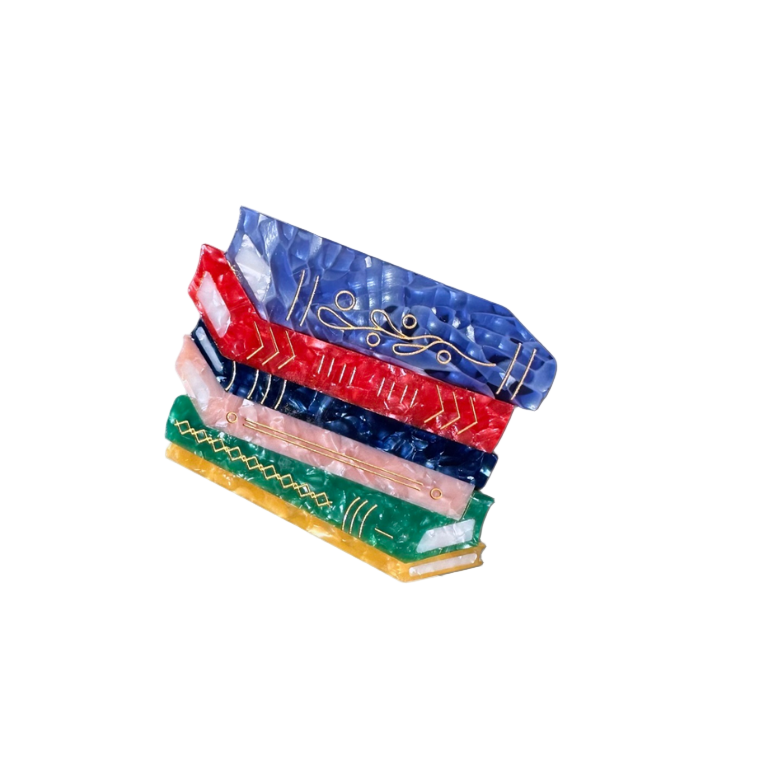 Stack of colorful book hair clip on a white background