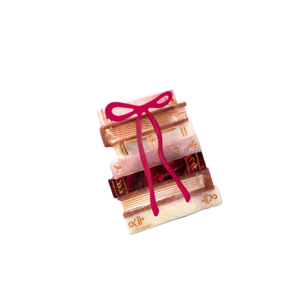 Set of books tied with a pink ribbon on a white background