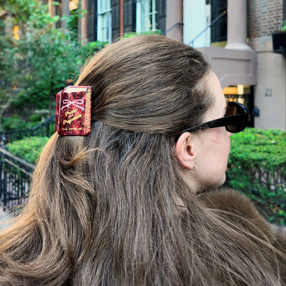 Person with a decorative hair clip in an urban setting