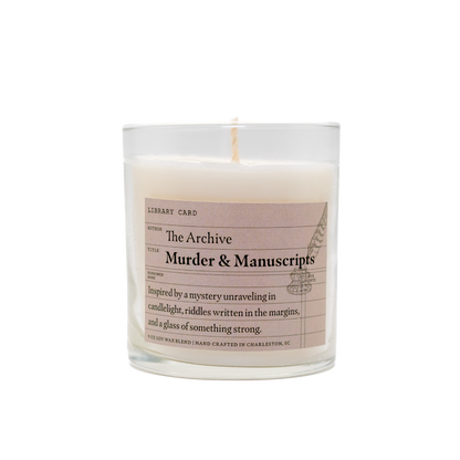 Candle with a label titled 'The Archive Murder & Manuscripts' on a white background