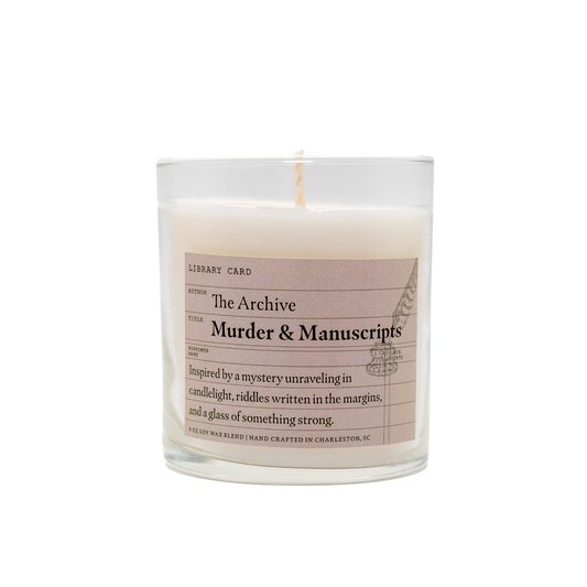 Candle with a label titled 'The Archive Murder & Manuscripts' on a white background