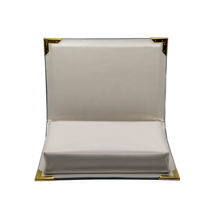 open Clutch bag with gold trim on a white background