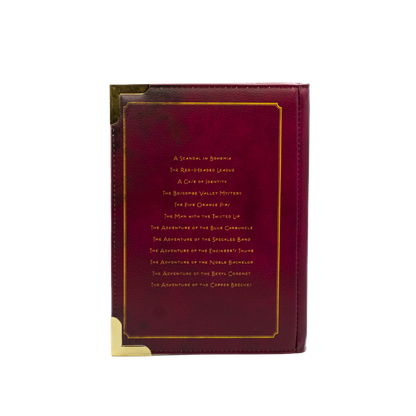 Maroon handbag with gold text on a white background