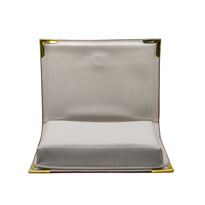 White rectangular object with gold border on a white background