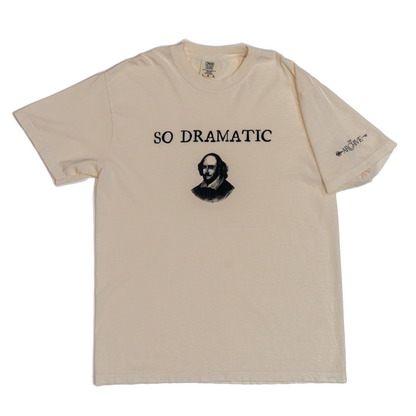 Beige t-shirt with a graphic and text 'SO DRAMATIC' on a white background
