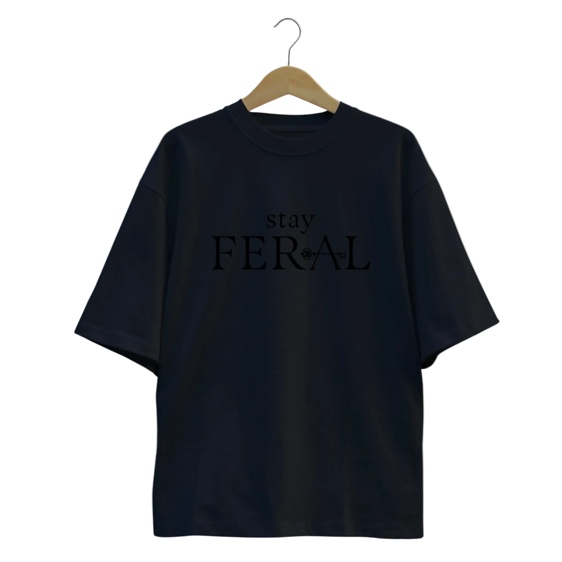 Black t-shirt with 'stay FERAL' text on a hanger against a white background