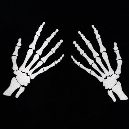 X-ray of two hands on a black background
