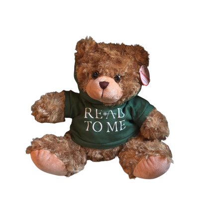 Teddy bear wearing a green shirt with 'READ TO ME' text on a white background