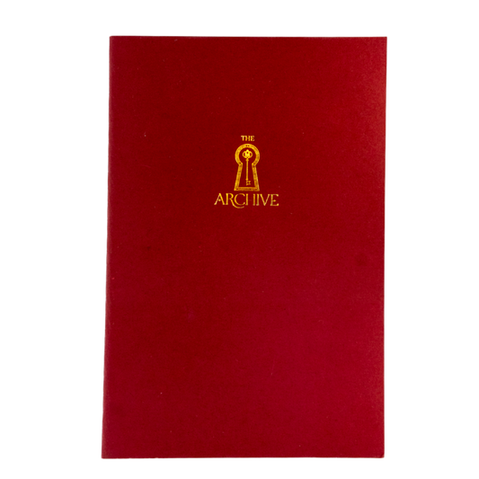 Red book with a gold logo and text on a white background