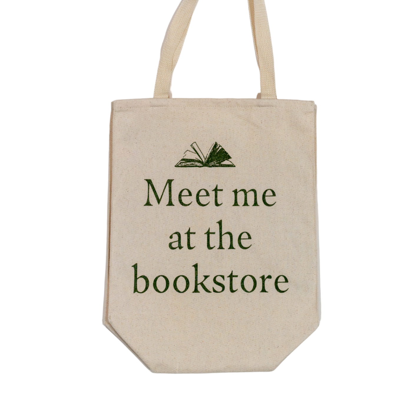 Beige tote bag with 'Meet me at the bookstore' text on a white background
