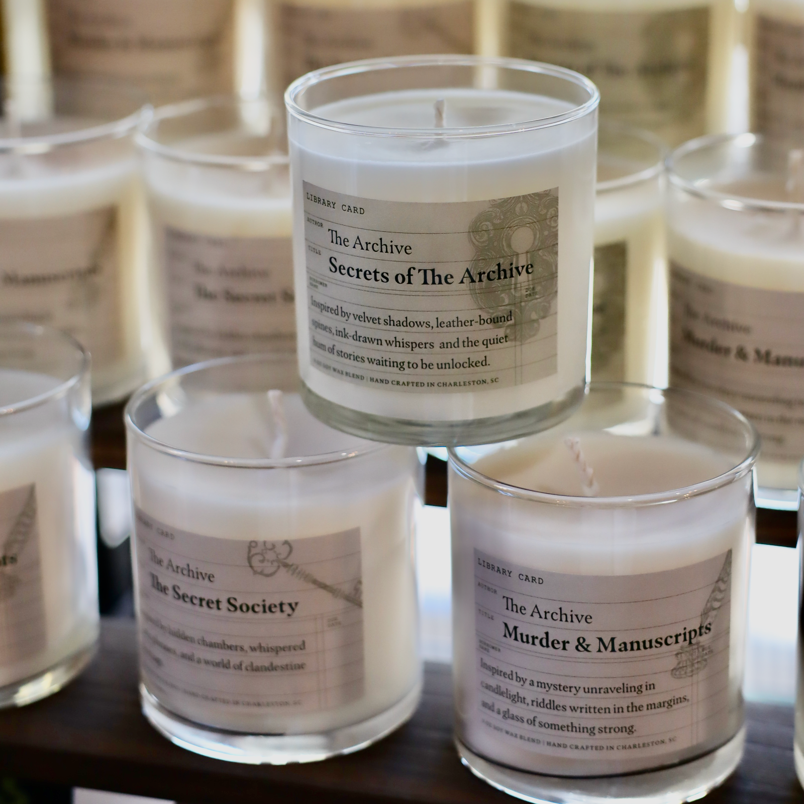The Archive Candles with labels on a shelf